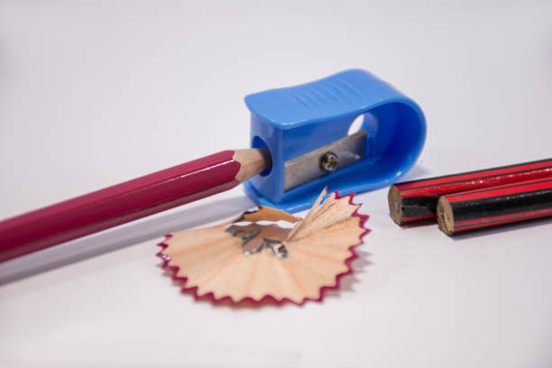 istock Pencil with sharpening shavings on white background,Students sharpen the pencil with a pencil sharpener 1013522308