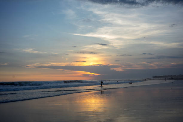 istock people on tropical beach at sunset 1013524064