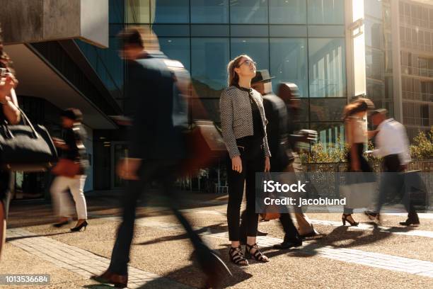 Businesswoman Standing Still On A Busy Street Stock Photo - Download Image Now - People, City, Crowd of People