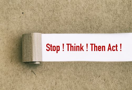 Stop, think, then act written under torn paper.