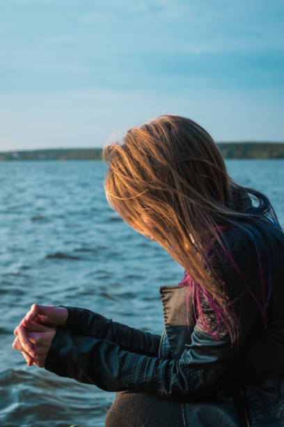 istock Girl looking at lake water 1013542238