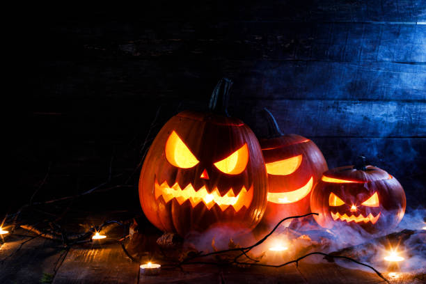 istock Halloween pumpkins and candles 1013545378