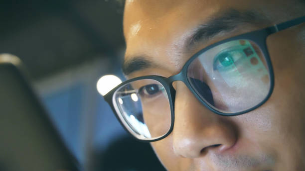 istock Close-up man looking mobile phone 1013546474