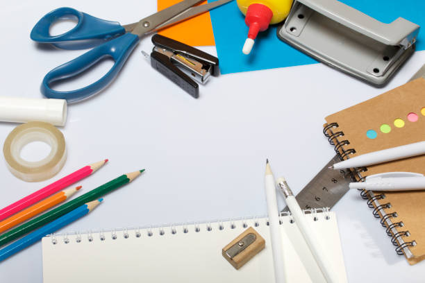 istock Stationery for school and teaching. Notepads and pens with pencil for writing. 1013549294