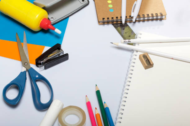 istock Stationery for school and teaching. Notepads and pens with pencil for writing. 1013549368