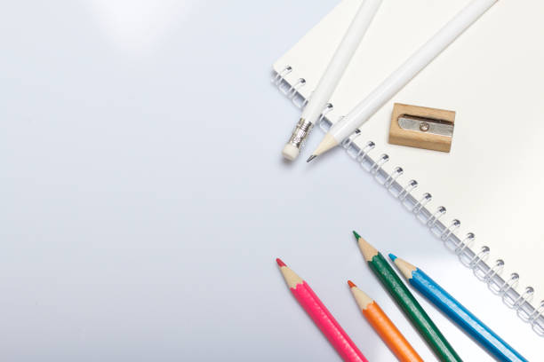 istock Stationery for school and teaching. Notepad and pencils for writing and drawing. Sharpener for pencils. 1013549426