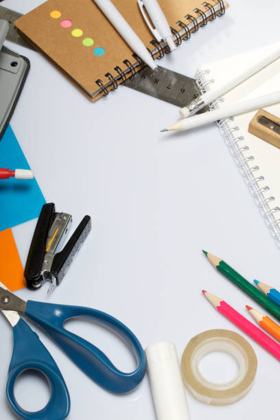 istock Stationery for school and teaching. Notepads and pens with pencil for writing. 1013549432