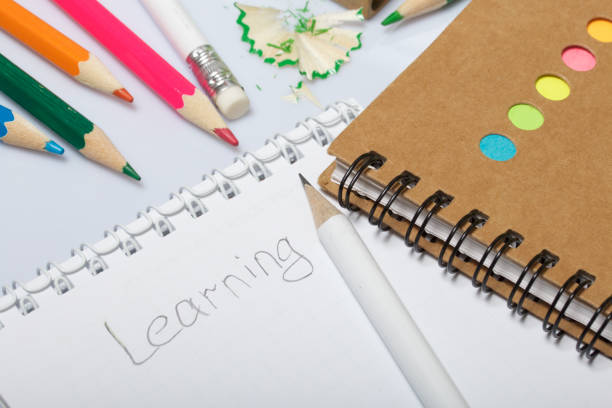 istock Stationery for school and teaching. Notepad and pencils for writing and drawing. Sharpener for pencils. 1013549986
