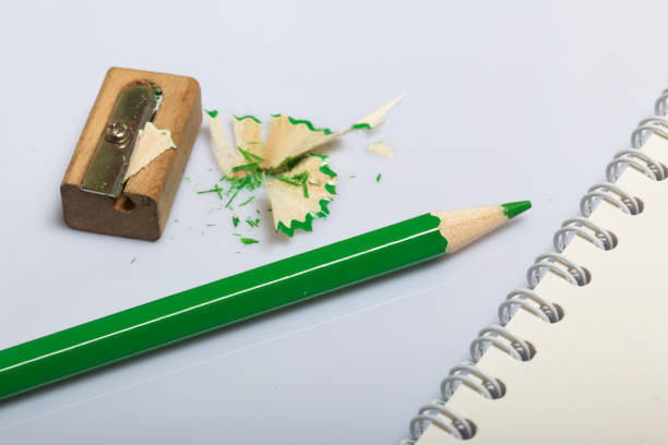 istock Stationery for school and teaching. Notepad and green pencils for writing and drawing. 1013550082