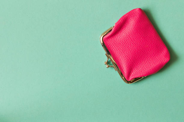 istock Pink wallet on turquoise background . Close up. Top view 1013554860