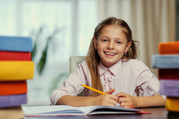 istock Positive little girl likes reading. 1013555190