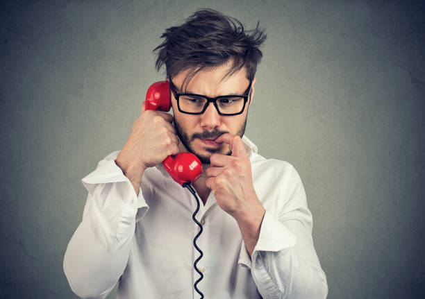 istock Anxious man speaking on phone receiving bad news 1013558740