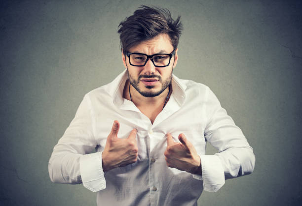 istock Overreacting man pointing at himself in offense 1013558798