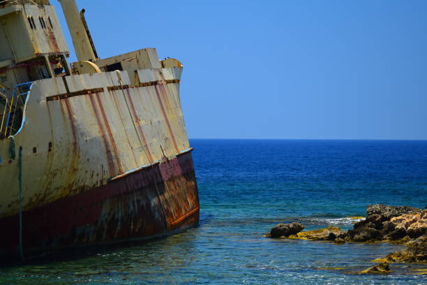 istock Stranded ship on rocky shore with turquoise water 1013558916
