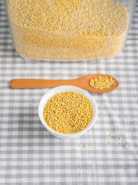 istock Gluten free grain millet in bowl on kitchen table 1013559238
