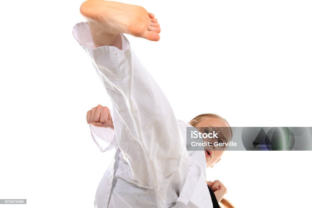 High Level Martial Art Training Martial artist kicking high. Adult Stock Photo