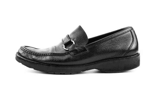 istock Black leather shoes isolated 1013573928