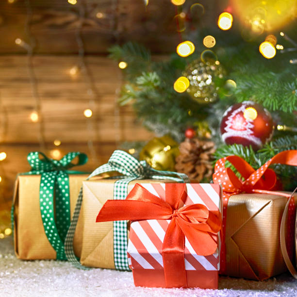istock Christmas treewith gifts, rustic background 1013581226