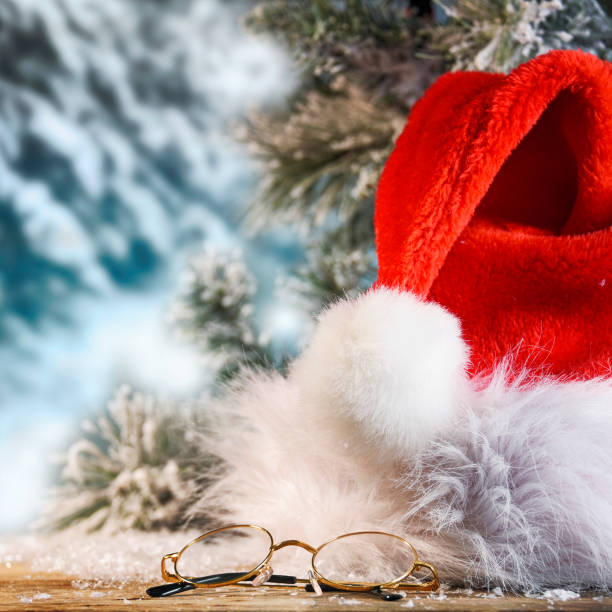 istock Winter Christmas background with Santas hat 1013582472