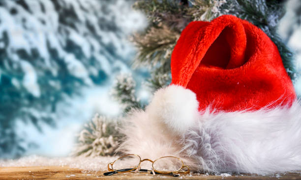 istock Winter Christmas background with Santas hat 1013587508