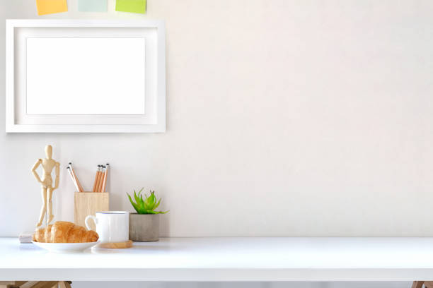istock Contemporary workspace with creative supplies and mockup poster. workplace and copy space. 1013596330