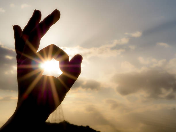 istock round hand sign Ok with sunny background 1013602086