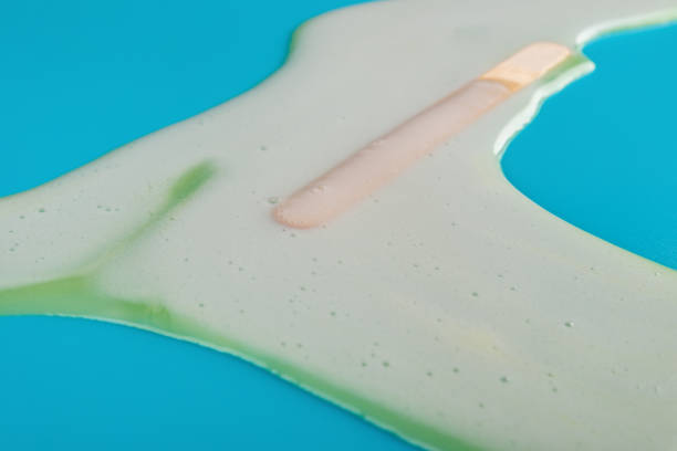 istock side view yellow popsicle melting completely on blue background 1013605998