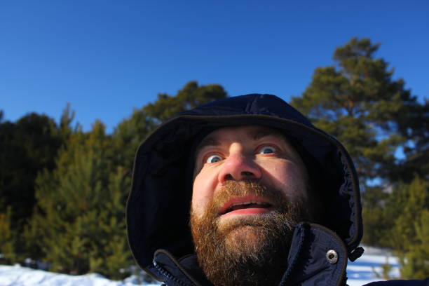 istock Brutal face of a man with beard. Winter portrait. 1013609322