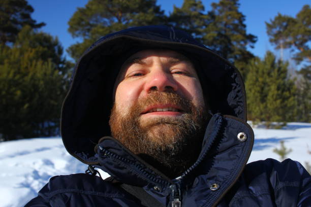 istock Brutal face of a man with beard. Winter portrait. 1013609362