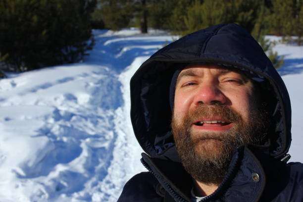 istock Brutal face of a man with beard. Winter portrait. 1013609406