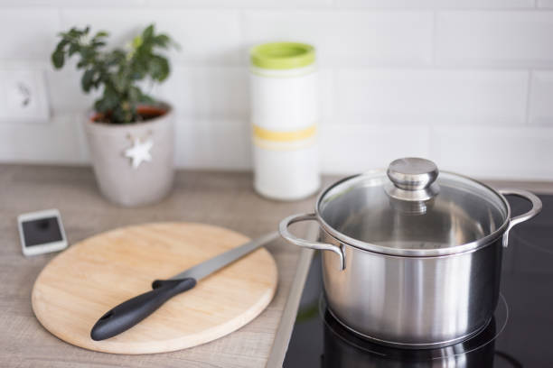 istock cooking concept - kitchen table with modern equipment and electric stove 1013625252