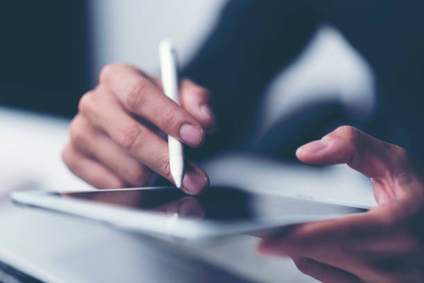 istock business documents on office table with smart phone and digital tablet and graph financial with social network diagram and man working in the background 1013625360