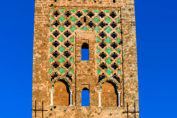 A part of massive entrance doors of Hassan II Mosque, decorated with traditional Moroccan patterns and an arch.
