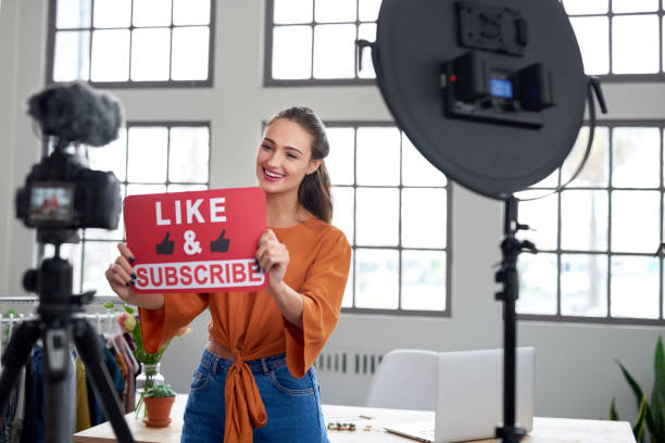 istock Young pretty vlogger asking for likes and to subscribe to channel 1013632324