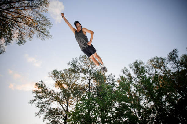 istock Young man flying on the trampoline outside 1013633038