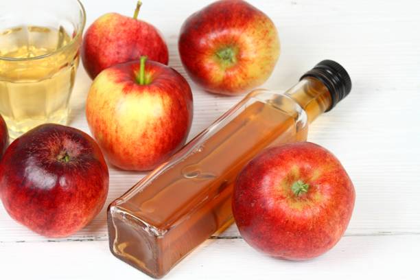 istock Apple vinegar in bottle and glass 1013635490