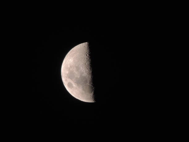 Photograph of the moon at night, in the clear sky.