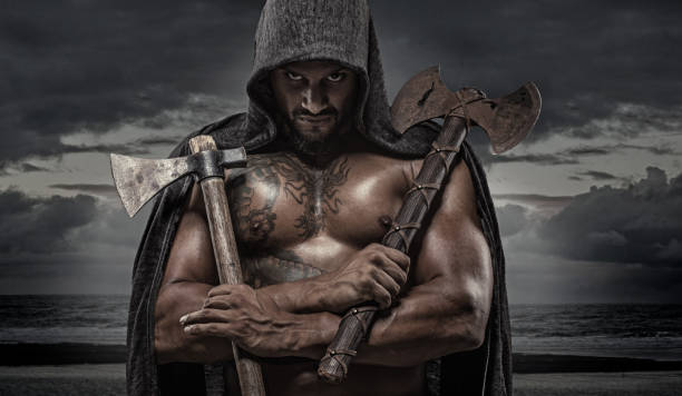 istock Weapon wielding Indian Descent warrior barbarian king alone in studio shoot 1013642996