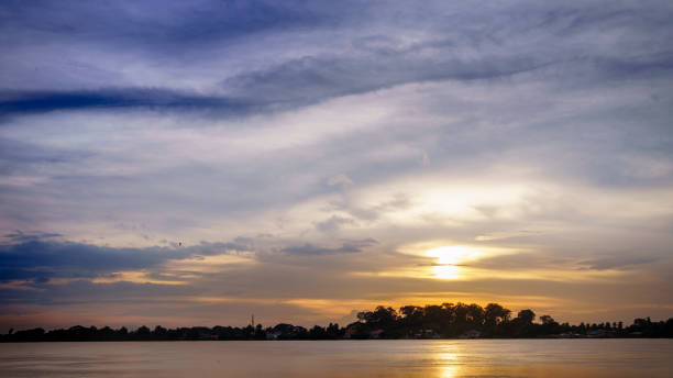 istock Colorful sky at sunset. Landscape sky at twilight time. Mirror sunset reflection on the water at Maekhong national river,Thailand 1013645450