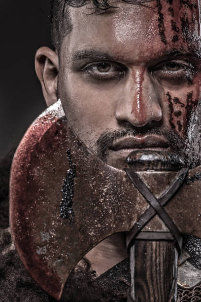 istock Weapon wielding Indian Descent warrior barbarian king alone in studio shoot 1013647788