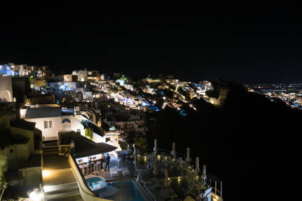 istock Whitewashed Houses on Cliffs with Sea View at Night in Imerovigli, Santorini, Greece 1013648320