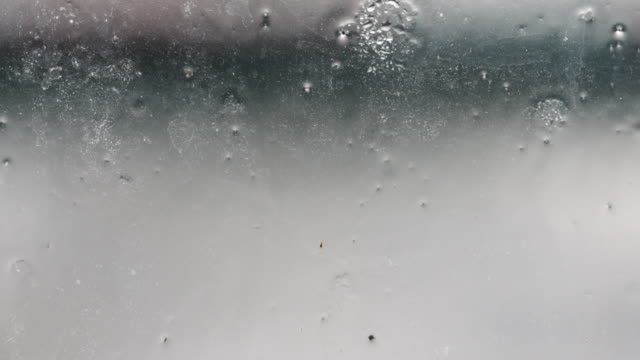 Rain drop falling down outside the window
