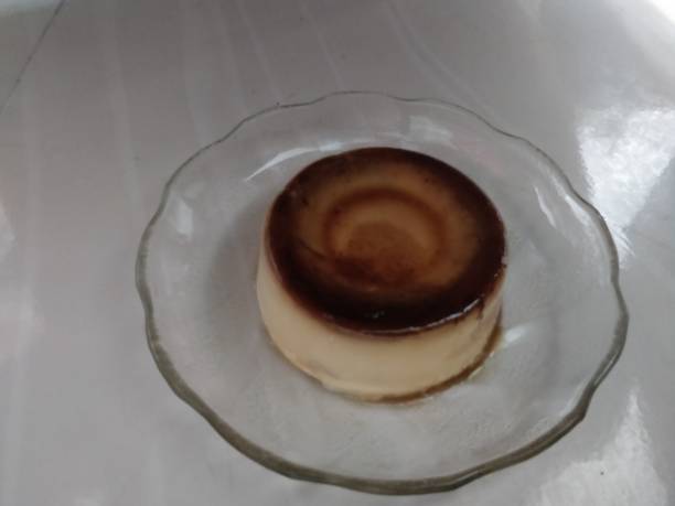 istock Caramel custard cake on white plate 1013654972