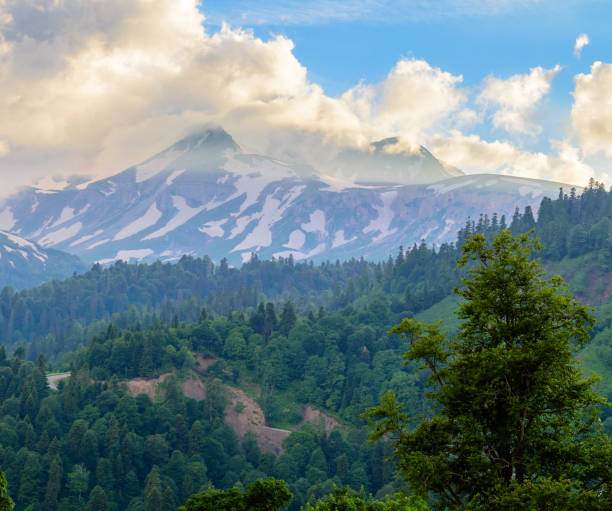 istock The mountain tops which are wrapped up with clouds 1013665404