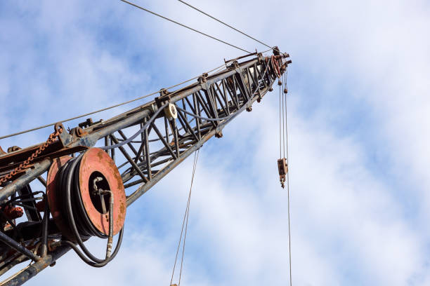 istock Power crane arm in under construction close up. 1013668012