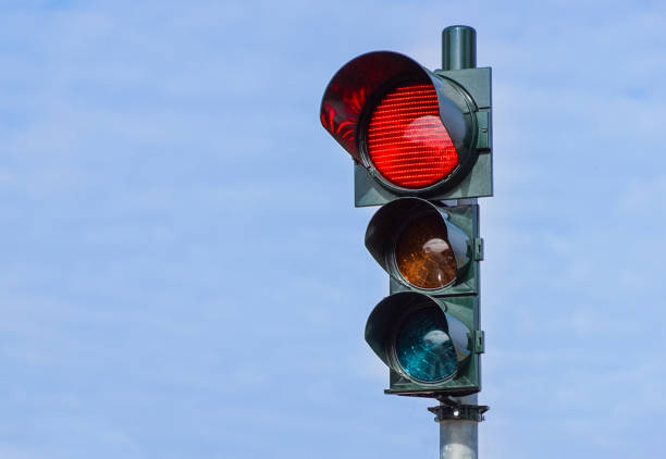 istock Red traffic light in the city street 1013668064