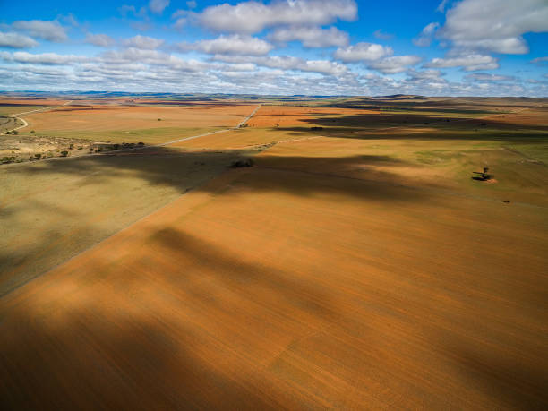 istock Clouds casting beautiful shadows on agricultural land in South Australia 1013668604