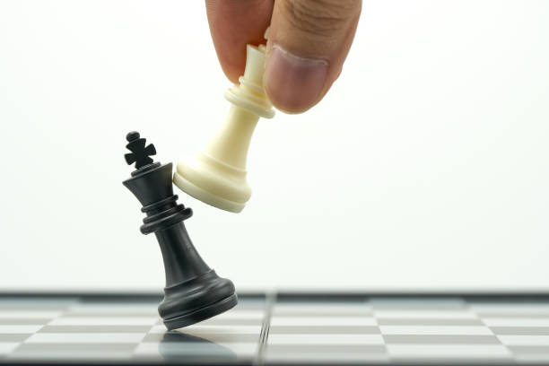 istock Businessman holding a King Chess is placed on a chessboard.using as background business concept and Strategy concept with copy space for your text or design. 1013674878