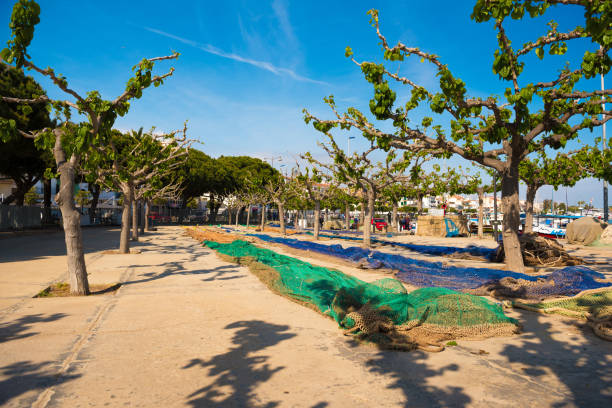 Colorful fishing nets in the port Cambrils, Catalonia, Spain. Copy space for text Colorful fishing nets in the port Cambrils, Catalonia, Spain. Copy space for text. cambrils stock pictures, royalty-free photos & images