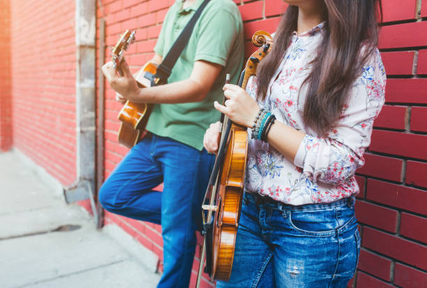 istock Musicians with guitar and violin 1013684660